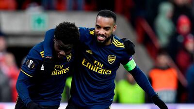 Arsenal's Bukayo Saka, left, with Alexandre Lacazette after scoring during the Europa League match against Standard de Liege. AFP