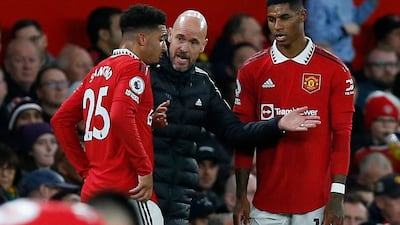 Manchester United manager Erik ten Hag gives instructions to Jadon Sancho and Marcus Rashford. Reuters