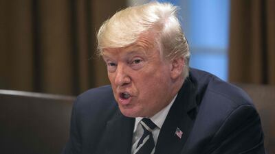 Donald Trump speaks about his meeting with President Vladimir Putin ahead of a meeting with Republican lawmakers and cabinet members. AFP/NICHOLAS KAMM