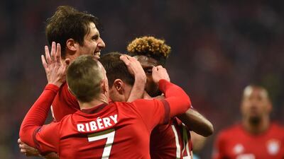 Bayern Munich’s Spanish midfielder Xabi Alonso, centre, celebrates with teammates scoring during the UEFA Champions League semi-final, second-leg football match between FC Bayern Munich and Atletico Madrid in Munich, southern Germany, on May 3, 2016. Christof Stache / AFP