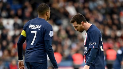 Paris Saint-Germain's Argentine forward Lionel Messi (R) and Paris Saint-Germain's French forward Kylian Mbappe react during the French L1 football match between Paris Saint-Germain (PSG) and Stade Rennais FC at The Parc des Princes Stadium in Paris on March 19, 2023. (Photo by FRANCK FIFE / AFP)