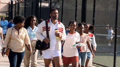 A scene from the film 'King Richard'. From left, Aunjanue Ellis as Oracene “Brandi” Williams, Mikayla Bartholomew as Tunde Price, Will Smith as Richard Williams, Saniyya Sidney as Venus Williams, Demi Singleton as Serena Williams and Danielle Lawson as Isha Price. Warner Bros via AP