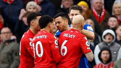 Nottingham Forest's Morgan Gibbs-White clashes with Everton's Dwight McNeil. Reuters