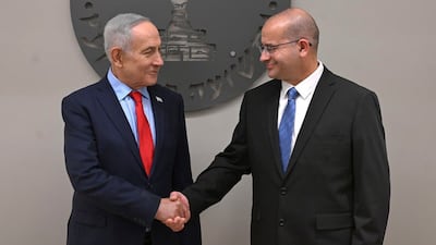 Prime Minister Benjamin Netanyahu shakes hands with new Mossad chief Roman Gofman at a welcoming ceremony on Tuesday. Photo: GPO Israel