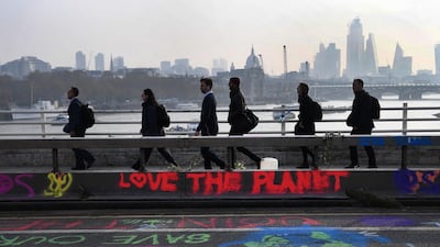 Graffiti on Waterloo Bridge during climate change protests in London. EPA