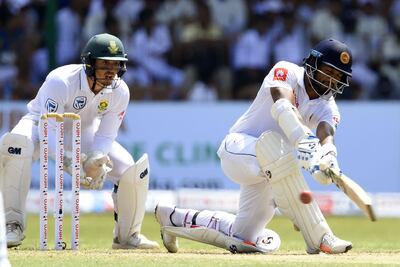 Dimuth Karunaratne, right, ended up scoring 85 for Sri Lanka on Sunday. Ishara S Kodikara / AFP
