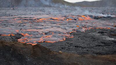 The volcano slowly oozes lava at times, then spurts like a geyser and spits rocks at intervals. AFP