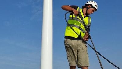 The Trident Support team erect a 120-metre flagpole.