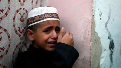 Palestinian Ahmed cries over the death of his father, Salafist leader Hisham Al Saedni, during his funeral at Al Bureij refugee camp in the central Gaza Strip yesterday.