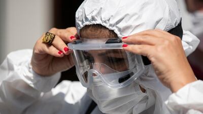A Turkish doctor wearing personal protective equipment attends a protest to draw attention to Covid-19 deaths and the increasing number of patients, in front of the Istanbul Faculty of Medicine on September 15, 2020. EPA