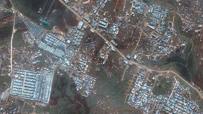 This satellite image provided by Maxar Technologies shows refugee camps for internally displaced people near Deir Hassan in northern Syria's Idlib province near the Turkish border on Feb. 16, 2020. AP