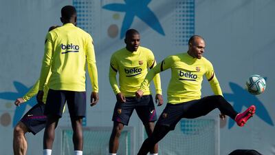 Barcelona's Martin Braithwaite, right, attends his first training session with the team at the Joan Gamper sport complex on Friday. EPA