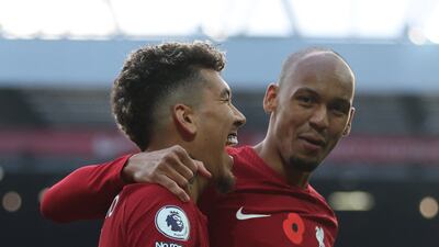 Roberto Firmino celebrates scoring their first goal with Fabinho. Reuters