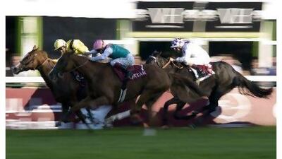 Nahrain, in yellow cap, wins the Qatar Prix De L'Opera at Longchamp on Sunday.