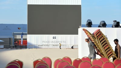 Workers making arrangements at the stadium. Khushnum Bhandari / The National