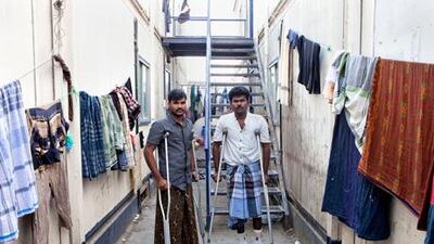 Fishermen Pandu Sanadhan (left), 26, and Muthu Muniraj, 28, at their accommodation inside the Dubai Offshore sailing Club. They were shot at by the US navy. Jaime Puebla / The National Newspaper