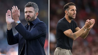 Manchester United manager Michael Carrick, left, and his Como counterpart Cesc Fabregas. Getty Images