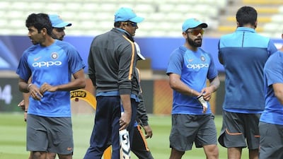 The break down in the relationship between India coach Anil Kumble, centre, and Inda captain Virat Kohli, centre right, has played a large part in contributing to the uncertainty surrounding Kumble's future. Rui Vieira / AP Photo