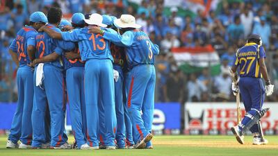 The Indian team huddle after the wicket of Thilan Samaraweera. Getty Images