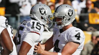 Oakland Raiders wide receiver Michael Crabtree and quarterback Derek Carr celebrate a touchdown in their NFL contest against the Pittsburgh Steelers on Sunday. Gene J Puskar / AP / November 8, 2015