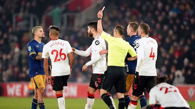 Referee Stuart Attwell shows a red card to Southampton's Duje Caleta-Car. PA