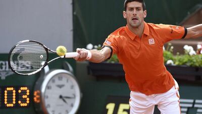 Serbia's Novak Djokovic returns the ball to Luxemburg's Gilles Muller during the men's second round at the Roland Garros 2015 French Tennis Open in Paris on May 28, 2015. AFP PHOTO / DOMINIQUE FAGET