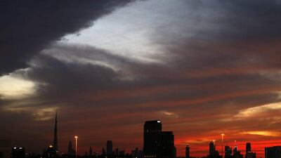 While red skies veiled the skies of Dubai, heavy showers hit the capital on Tuesday evening. AFP / Karim Sahib