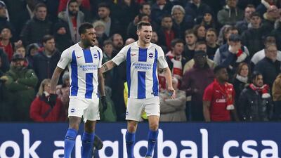 Brighton's Juergen Locadia, left, celebrates scoring with Pascal Grob. EPA