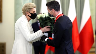 Robert Lewandowski is greeted by Polish First Lady Agata Kornhauser-Duda. EPA