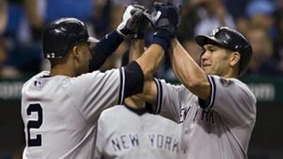 New York Yankees' Derek Jeter, left, congratulates Johnny Damon after his three-run homer.