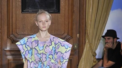 Stylised, almost cartoonish, outlined flower prints at Viktor & Rolf. AP