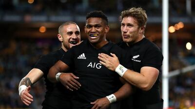 Waisake Naholo, centre, celebrates one of his two tries for New Zealand against Australia. Getty Images