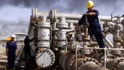 Workers at the Rumaila oil refinery near Basra. BP is the main contractor in the Rumaila oilfield – the country's largest, in which it holds a 38 per cent share. AP