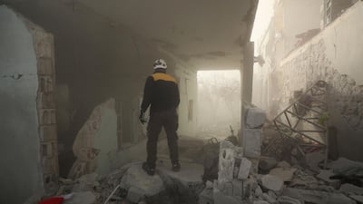 Members of the Syrian Civil Defence, also known as the White Helmets, and other people search for victims and survivors from the rubble. AFP