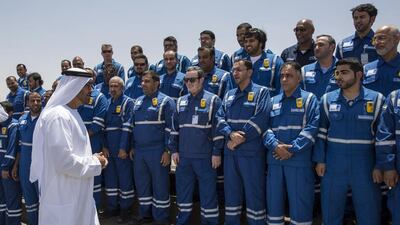 Sheikh Mohammed bin Zayed, left, Crown Prince of Abu Dhabi and Deputy Supreme Commander of the UAE Armed Forces, speaks with Al Hosn employees. Ryan Carter / Crown Prince Court - Abu Dhabi