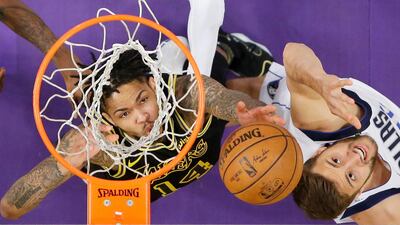 Los Angeles Lakers forward Brandon Ingram and Dallas Mavericks forward Maximilian Kleber reach for a rebound during the second half of an NBA basketball game in Los Angeles. Mark J. Terrill / AP Photo