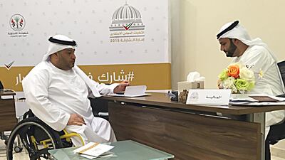 Khaled Al Shamsi, 46, director at Sharjah TV, submits his papers for the candidacy of the Sharjah Consultative Council, which will face elections next month. Thaer Zriqat / The National
