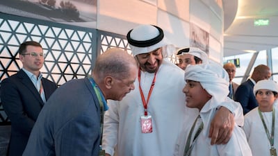Sheikh Mohamed bin Zayed, introduces Sheikh Zayed bin Mohamed (R) to James Alix Michel, former President of Seychelles (3rd R), at tje 2014 Abu Dhabi Grand Prix. Mohammed Al Hammadi / Crown Prince Court - Abu Dhabi