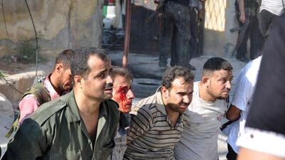 Police officers are detained by the Free Syrian Army. Pierre Thomas / AFP Photo