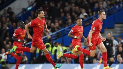 Jordan Henderson, right, celebrates scoring Liverpool's second goal against Chelsea at Stamford Bridge in London on Friday night. Andy Rain / EPA
