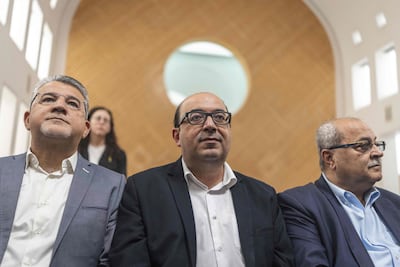Israeli Arab politician Sami Abu Shehadeh, centre, withdrew from a race after Supreme Court judges on appeal told him a majority of their panel would disqualify him. AFP