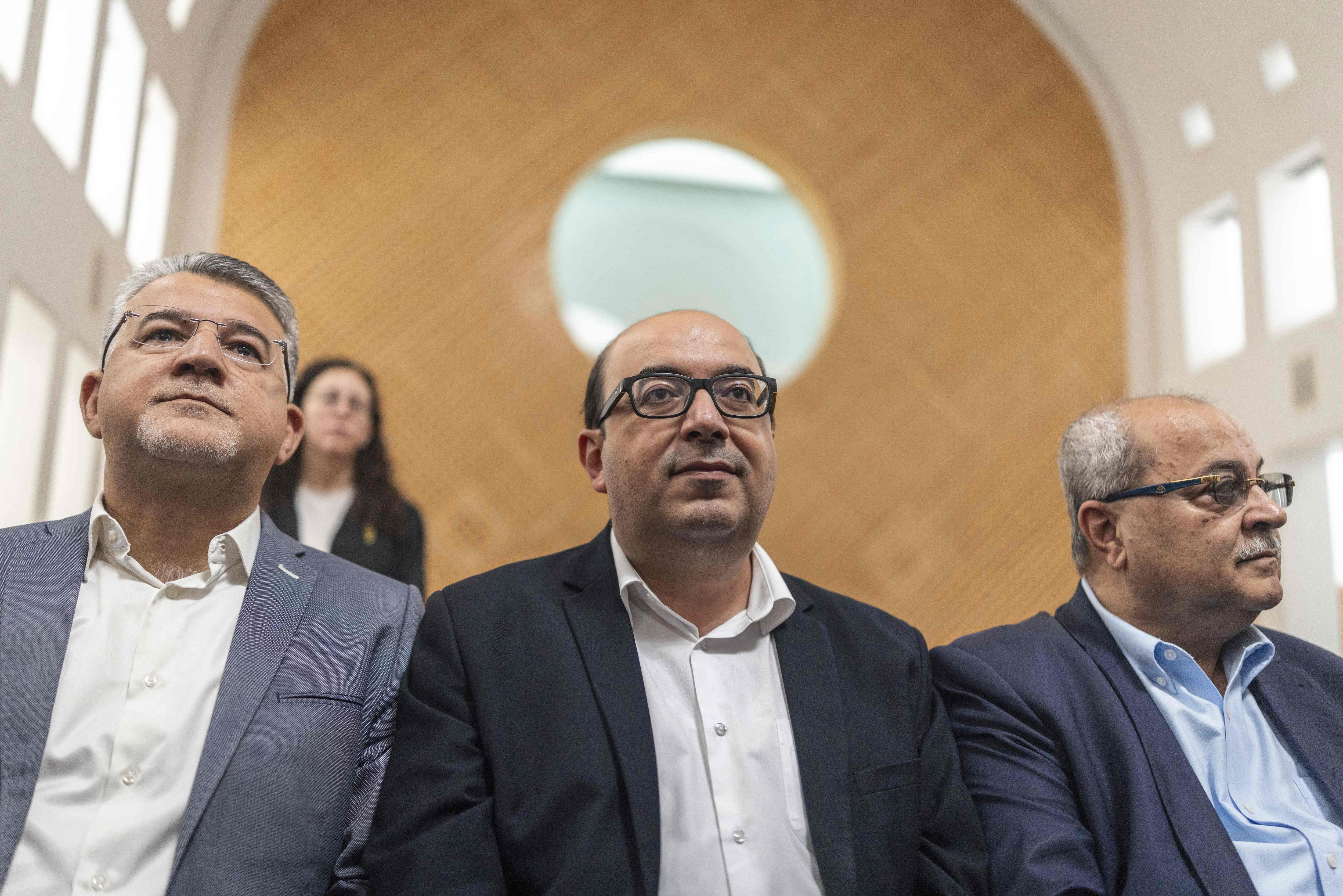 Israeli Arab politician Sami Abu Shehadeh, centre, withdrew from a race after Supreme Court judges on appeal told him a majority of their panel would disqualify him. AFP