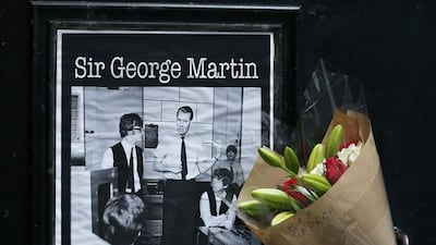 A floral tribute in memory of music producer George Martin is left outside the Cavern Club in Liverpool. Phil Noble / Reuters