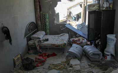 A bedroom damaged during airstrikes by the Syrian regime and their allies near the town of Saraqeb. AFP