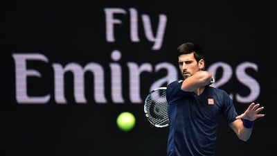 Novak Djokovic plays a shot during a practice session on Friday ahead of the Australian Open. Julian Smith / EPA