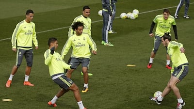 Gareth Bale, right, has been training with his Real Madrid teammates this week, although his place in the matchday squad is uncertain. JJ Guillien / EPA