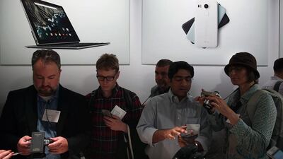 Attendees inspect the new Nexus 5X phone. Justin Sullivan / Getty Images / AFP
