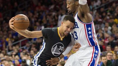 Stephen Curry of the Golden State Warriors goes against Robert Covington of the Philadelphia 76ers during their NBA contest on Saturday night. Bill Streicher / USA Today Sports / January 30, 2016