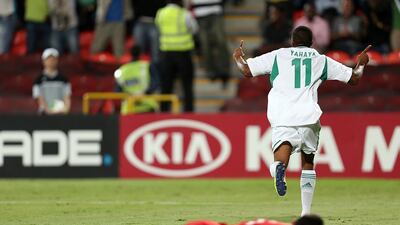 Nigeria's Musa Yahaya, right, celebrates one of their three goals against Mexico, the first coming off an own goal, as the Golden Eaglets won the Fifa Under 17 World Cup title match at at Mohammed Bin Zayed Stadium in Abu Dhabi on Friday. Sammy Dallal / The National