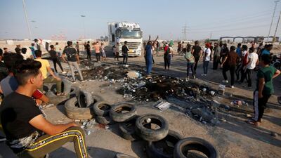 Iraqi protesters gather as they block the entrance of Umm Qasr Port, during ongoing anti-government protests, south of Basra, Iraq November 3, 2019. Reuters